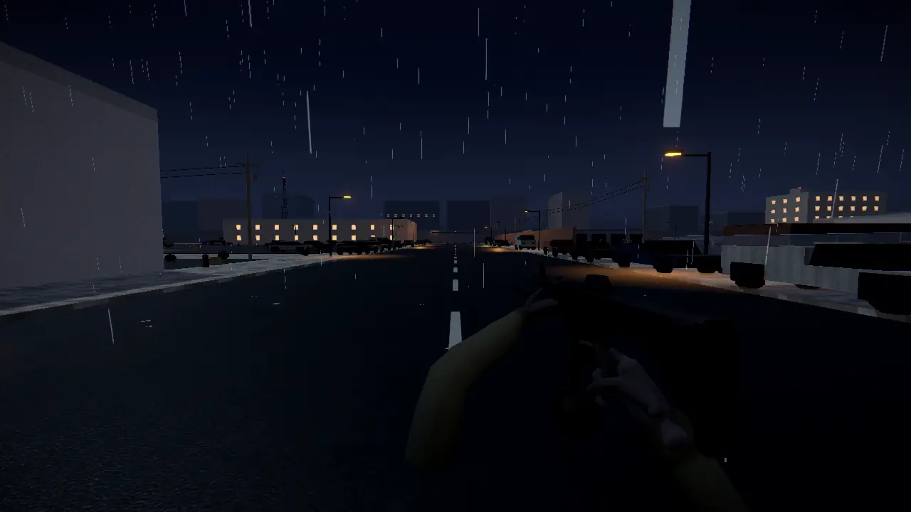 The same street at night in the rain, lamps lit.